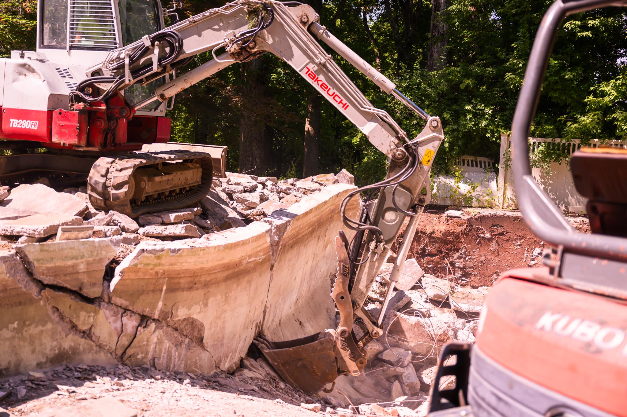 As you can see this excavator is using claw to dismantle concrete.