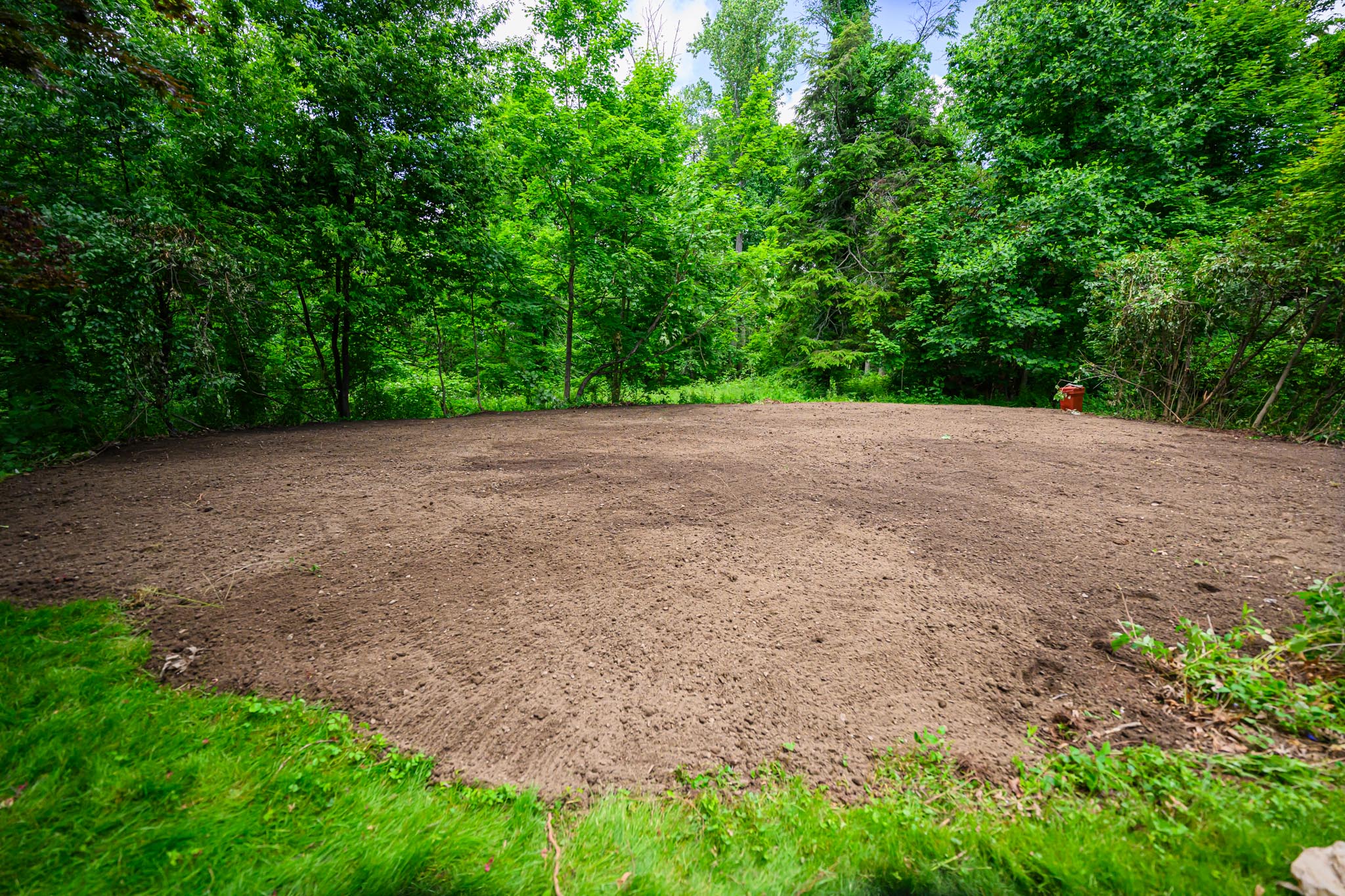 Customers backyard where pool use to be located now is filled in with topsoil and ready for landscaping.