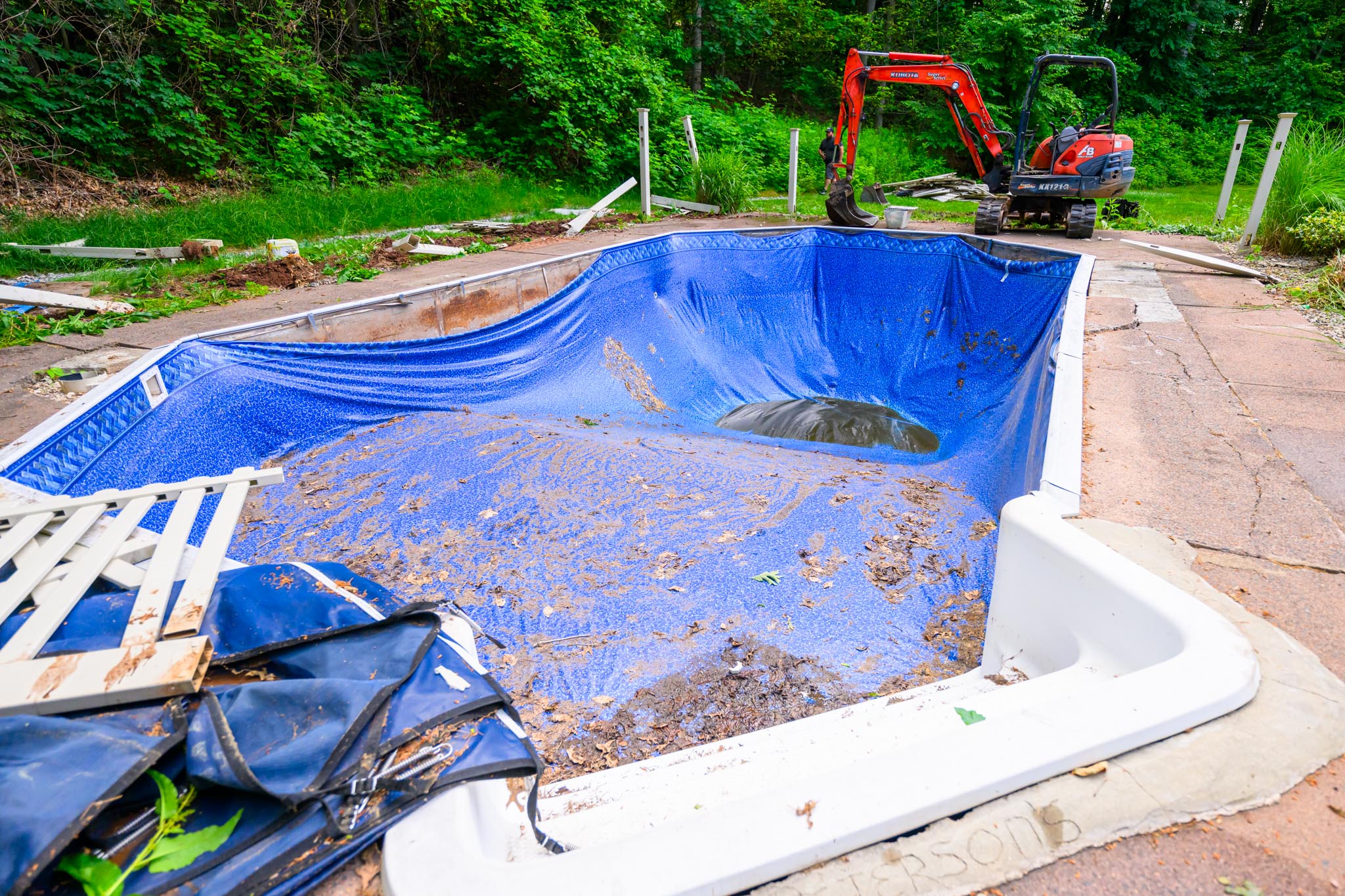 The white fencing has been removed around pool to start the demolition of pool.