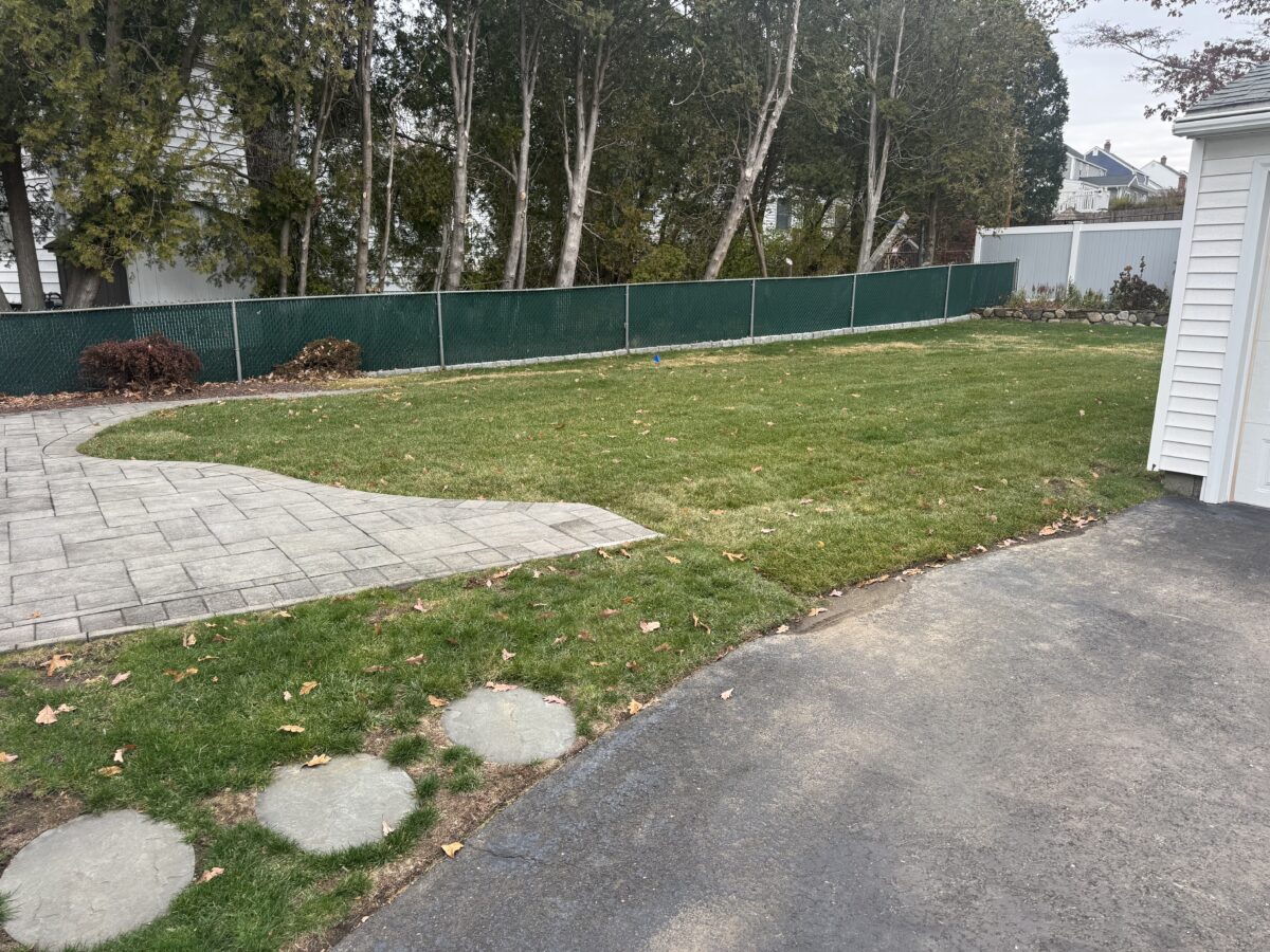 Completed Stratford CT pool removal with new sod lawn—clean, usable yard where the vinyl liner pool used to be